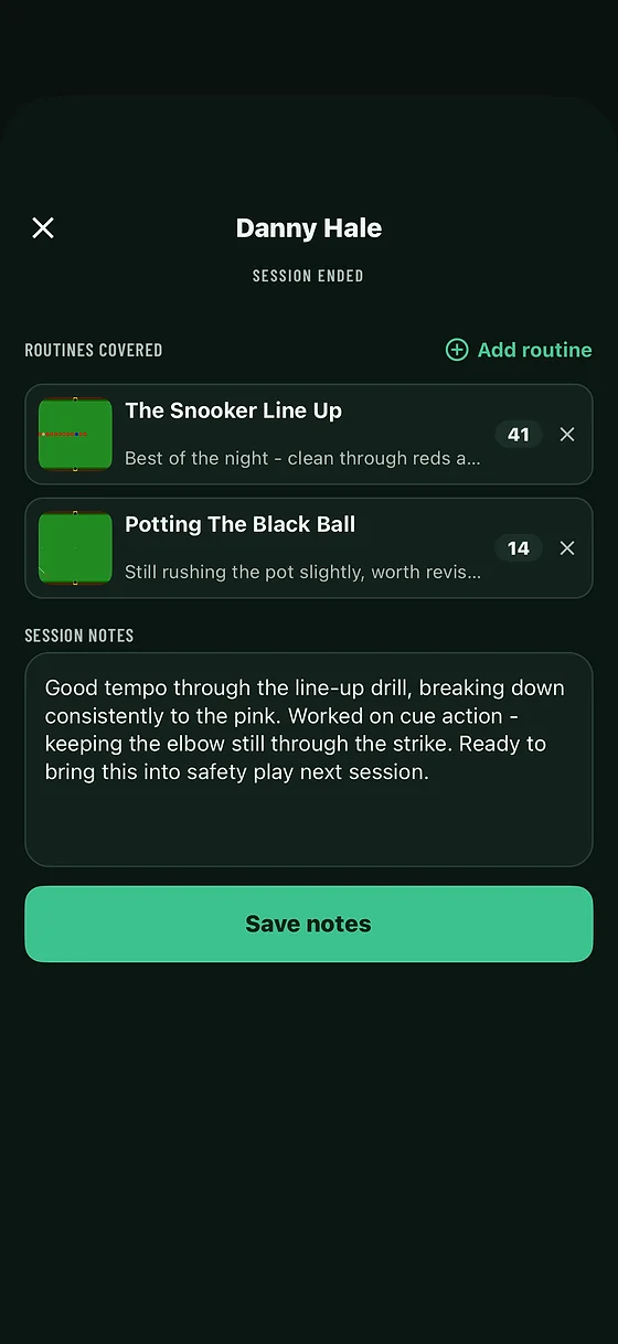 A coach logging session notes and routine scores after a session in Snookered